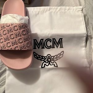 New in the box….MCM pink slides sz10